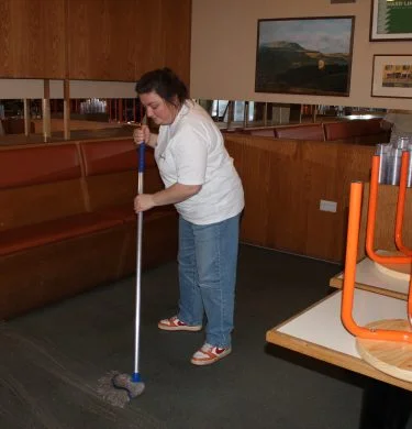 Mopping a restaurant floor